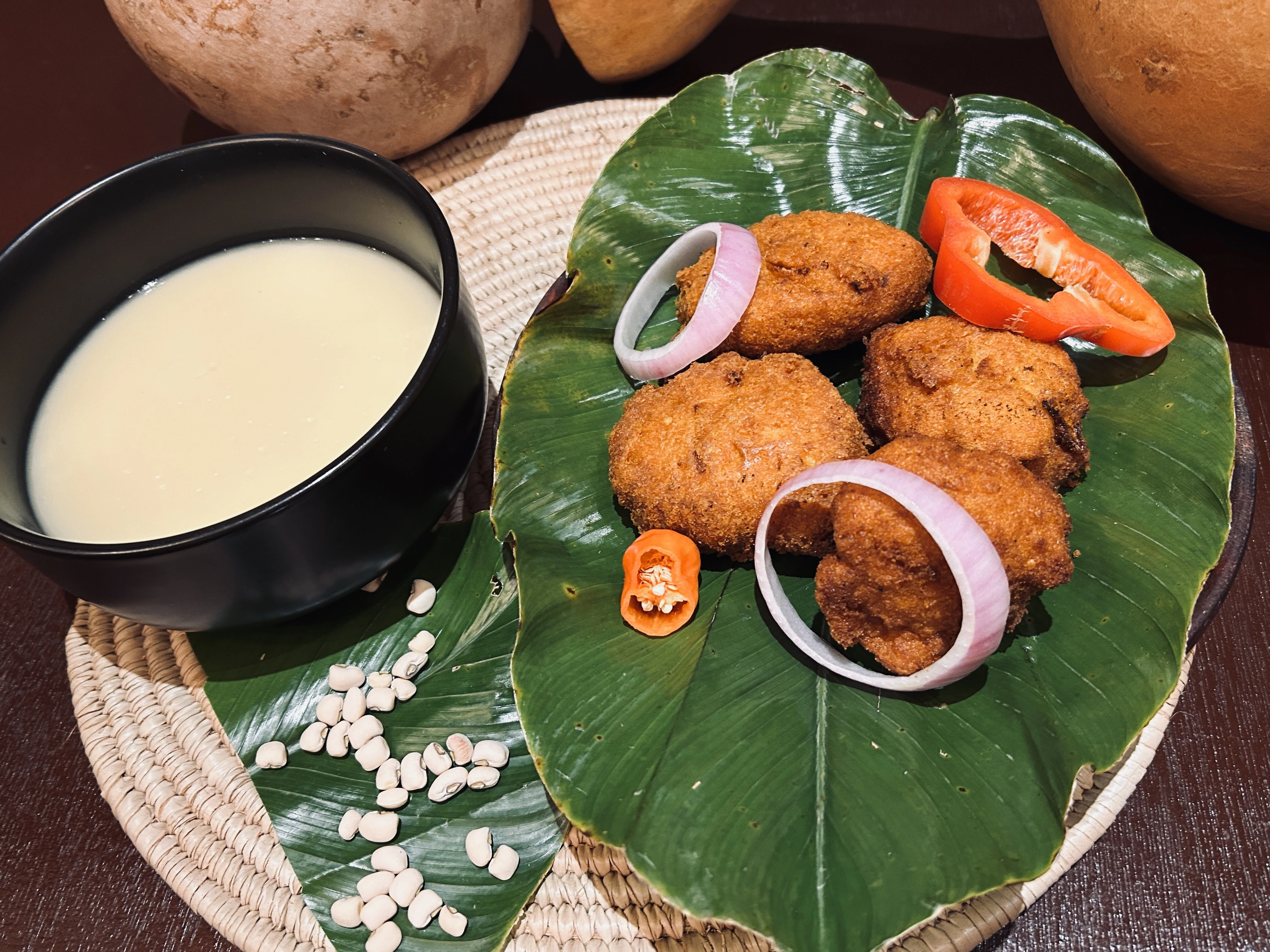 Akara and pap served on a banana leaf at Iroko